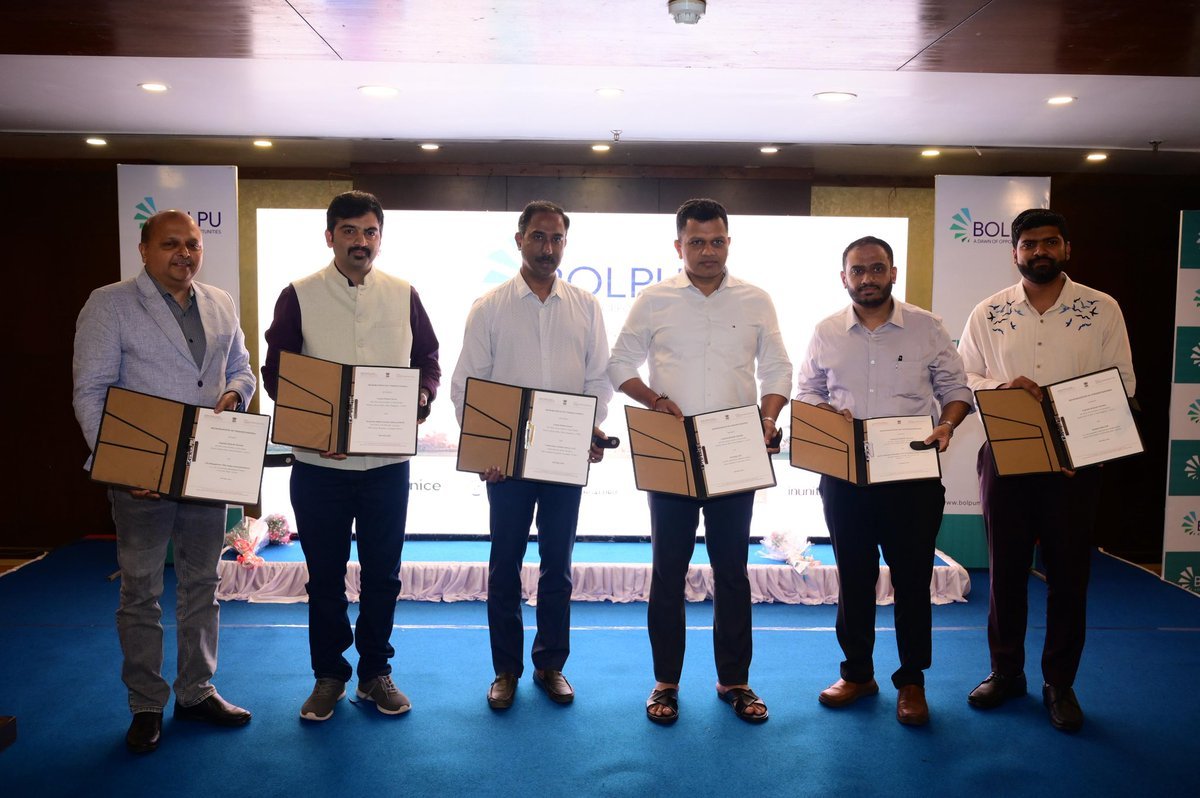 Founders and partners with signed agreements on stage at the Bolpu launch, The Ocean Pearl, Mangaluru
